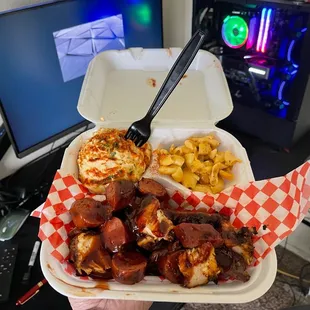 a person holding a tray of food