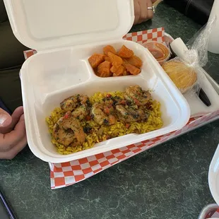 Shrimp with butter and garlic over rice with yams