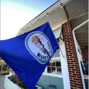 a blue flag with a picture of a man on it