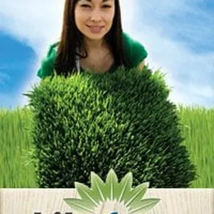 a woman holding a sign in a field