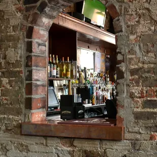 Interior shot of Rhinehaus to exemplify its charming interior featuring exposed brick.