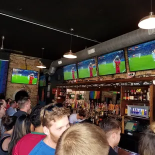 a large group of people watching televisions