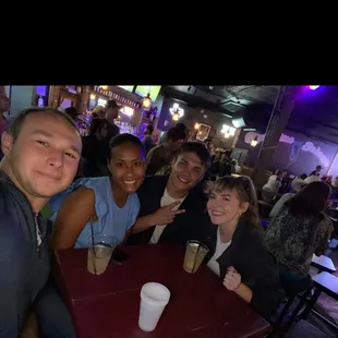 a group of people sitting at a table