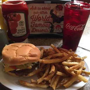 a hamburger and fries on a plate