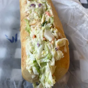 a hot dog with coleslaw