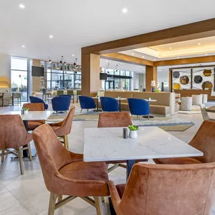 a restaurant with a marble table and chairs