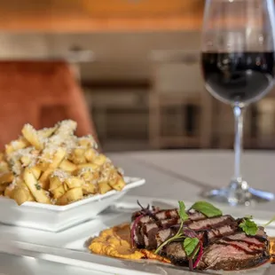 Enjoy Steak &amp; Frites with a glass of wine for dinner at RhuBAR | Kitchen &amp; Cocktails