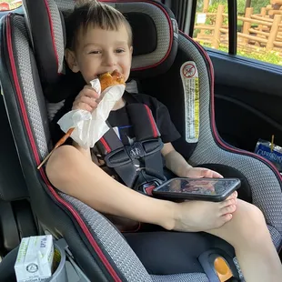 My son enjoying the house dipped corn dog