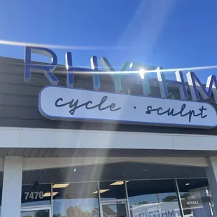 Rhythm exterior sign is up and here to greet the community!
