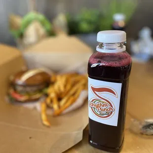 a bottle of juice and french fries