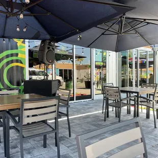 Lots of shaded seating outside the front door with caribbean vibe music playing. Also some seating inside.