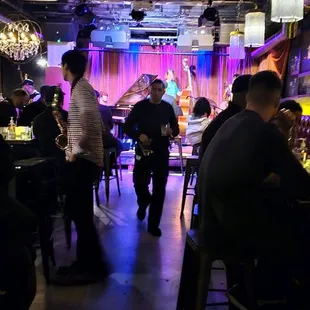 a group of people sitting at a bar