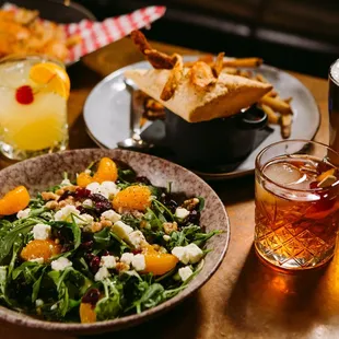 a plate of salad and a glass of beer