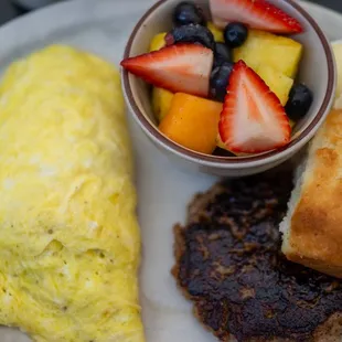 an omelet, fruit and bread