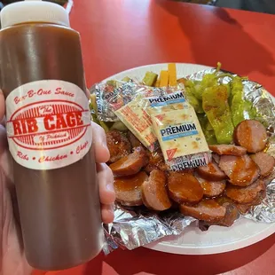 Sausage &amp; Cheese Plate and a bottle of sauce with that classic logo - perfection all around