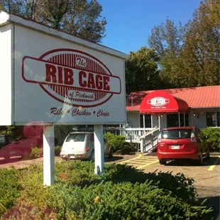 a car parked in front of a restaurant