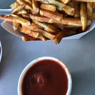 french fries and ketchup on a table