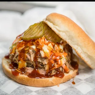 Main Ingredient Pulled Pork Sandwich with Slaw, Sauce and Pickles