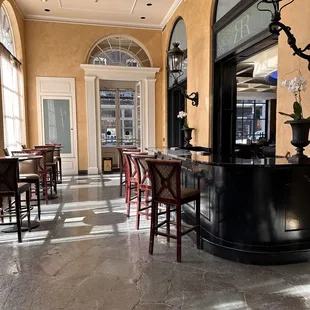 a row of tables and chairs in a restaurant