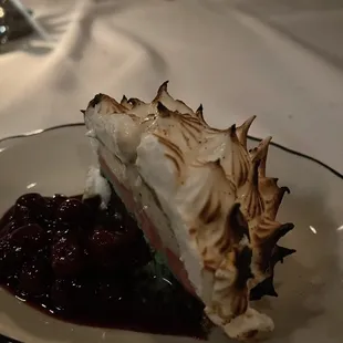 a slice of meringue pie on a plate
