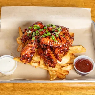 Wings on a bed of Fries