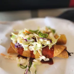 a hot dog with coleslaw and ketchup