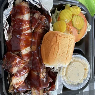 bbq pulled pork sandwich and pickles