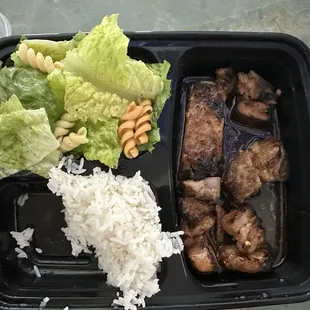 Sweet chili ribs... missing a few bites of the rice and ribs.