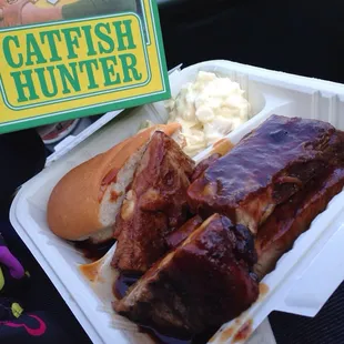 a box of coleslaw and a sandwich