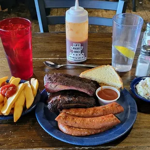 a plate of ribs and french fries