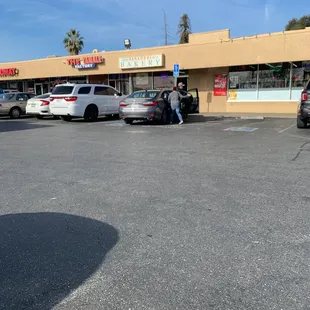 a parking lot with cars parked in front