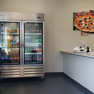 a view of the counter and the refrigerator