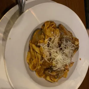 a plate of pasta with cheese