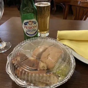 a plate of food and a glass of beer