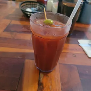 a drink with a straw and a lime