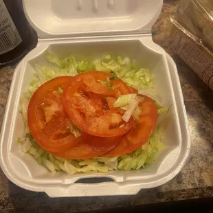 Lettuce and tomato on the side to go with the Cheesesteaks