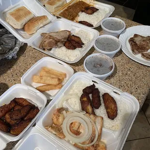 a variety of food items in styrofoam containers