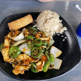 a plate of food and a soda