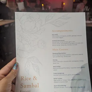 a person holding a menu