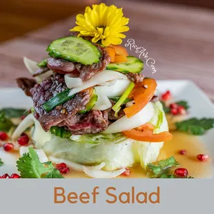 beef salad on a white plate