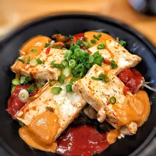 Rice, tofu, edamame, bean sprouts, scallions, peanut sauce, and hot sauce