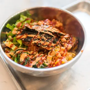 a bowl of food on a tray
