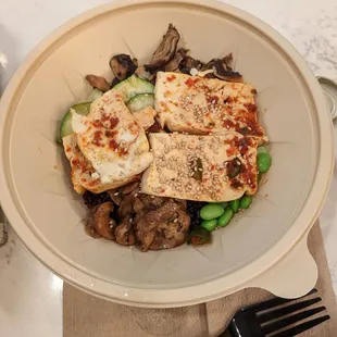 Bibimbap with spicy tofu, eggplant, mushroom, zucchini, edamame.