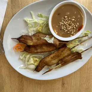 Chicken Satay with peanut dipping sauce.