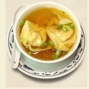 a bowl of soup with dumplings
