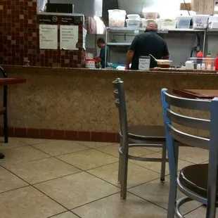 a man preparing food in a restaurant