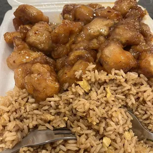Orange chicken and fried rice(had peas and carrots in it, but I gave most to my baby).