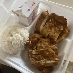 chicken and rice in a styrofoam container