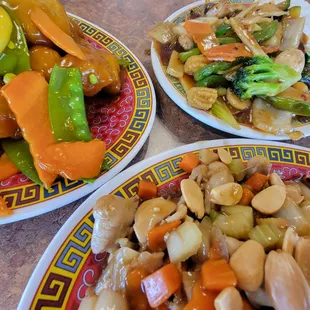 three plates of food on a table