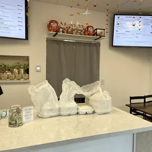 Small seating area. There are only 2 tables. Can't see the other one because there were patrons dining.